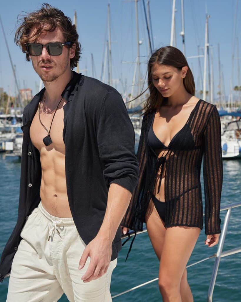 Greg O'Gallagher and beautiful girl walking on a boat.